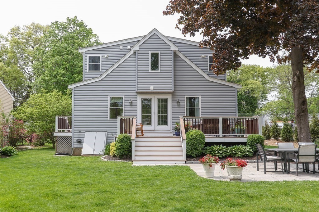 18 Moore Street Natick, MA 01760 - Photo 7 of 42 a view of a house with a yard and sitting area