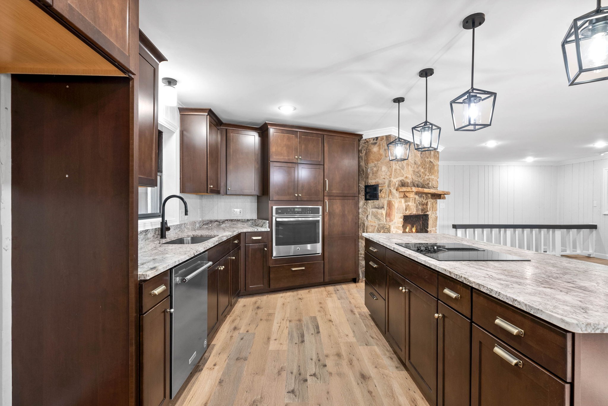 140 Dean Road Clarksville, TN 37040 - Photo 13 of 44 a large kitchen with granite countertop a large island in the center and stainless steel appliances