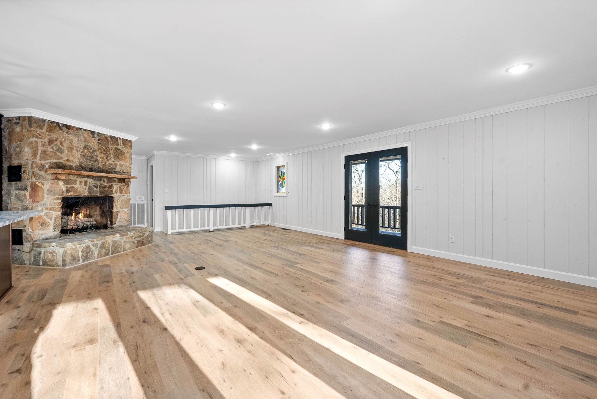 140 Dean Road Clarksville, TN 37040 - Photo 14 of 44 a view of an empty room with wooden floor and a fireplace