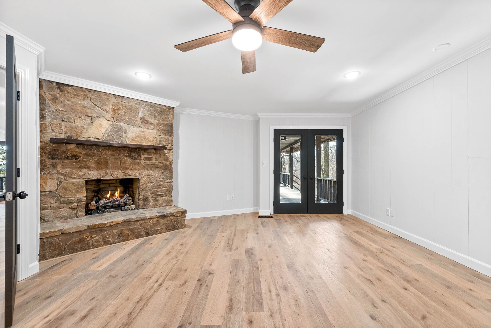 140 Dean Road Clarksville, TN 37040 - Photo 22 of 44 a view of an empty room with wooden floor fireplace and a window