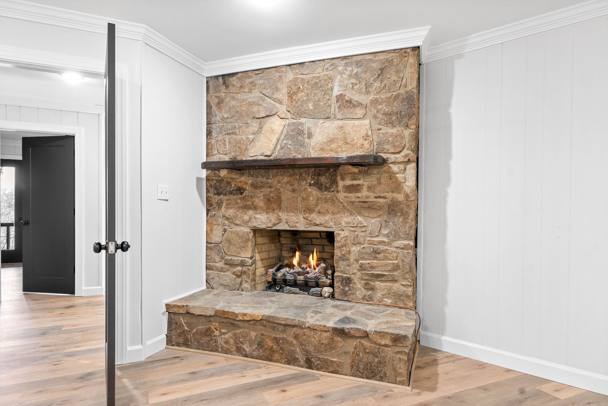 140 Dean Road Clarksville, TN 37040 - Photo 23 of 44 a living room with a fireplace and a floor to ceiling window