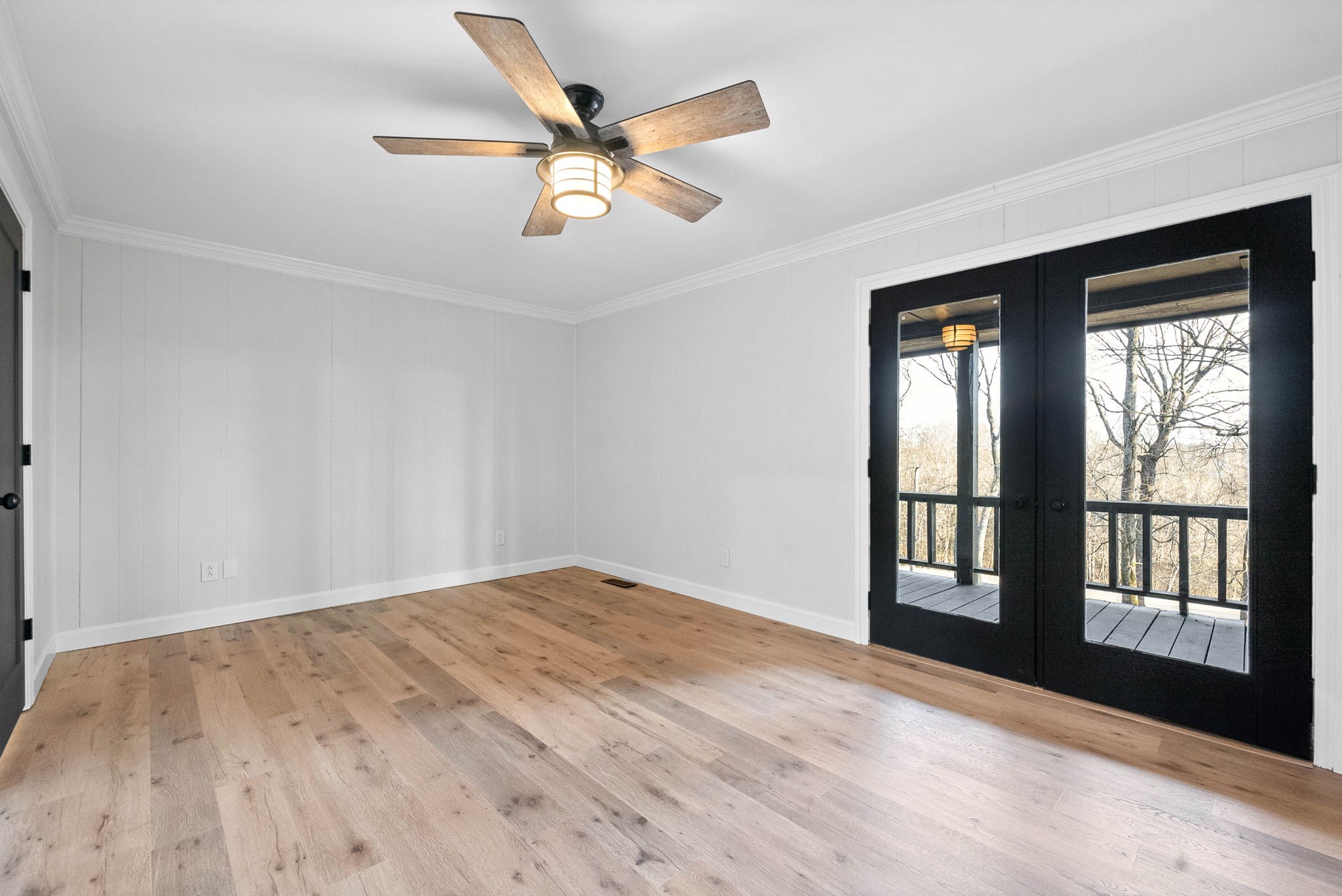 140 Dean Road Clarksville, TN 37040 - Photo 26 of 44 a view of an empty room with a window and wooden floor