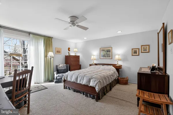 a bedroom with a bed and a dresser in it