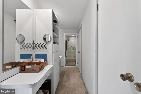 a bathroom with a double vanity sink toilet and shower