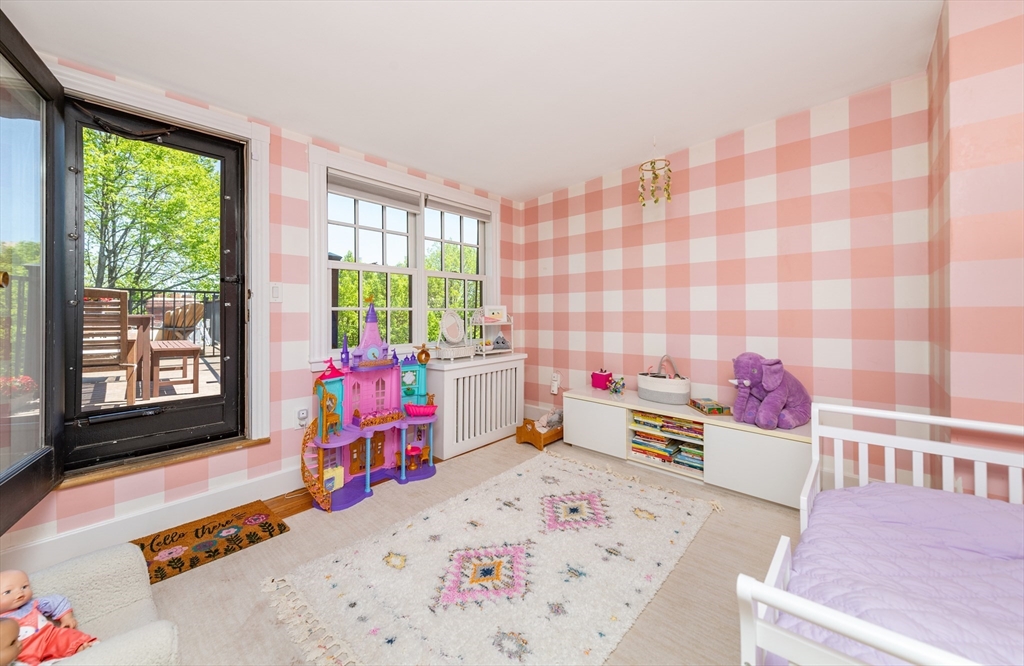 13 Harvard Street, Unit 3 Boston, MA 02129 - Photo 11 of 14 a bedroom with furniture and a window