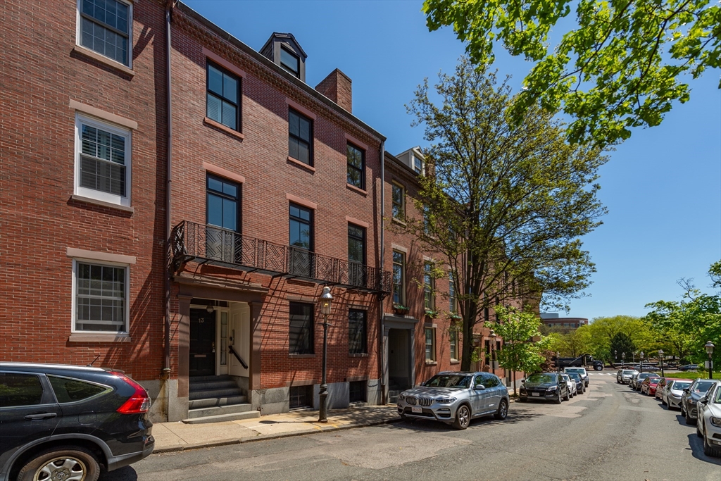 13 Harvard Street, Unit 3 Boston, MA 02129 - Photo 14 of 14 a car parked in front of a building