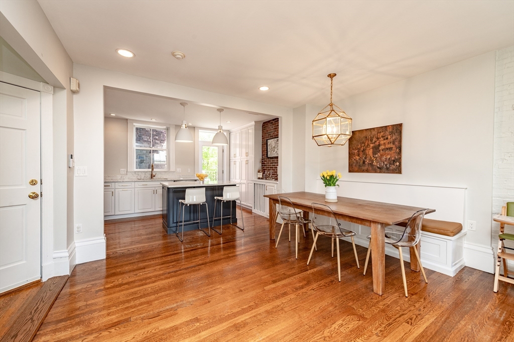 13 Harvard Street, Unit 3 Boston, MA 02129 - Photo 4 of 14 a view of a dining room with furniture window and wooden floor