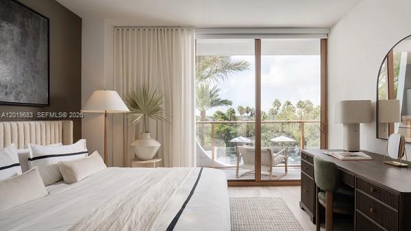 3900 Alton Road, Unit 503 Miami Beach, FL 33140 - Photo 8 of 37 a bedroom with a bed and a lamp next to a window