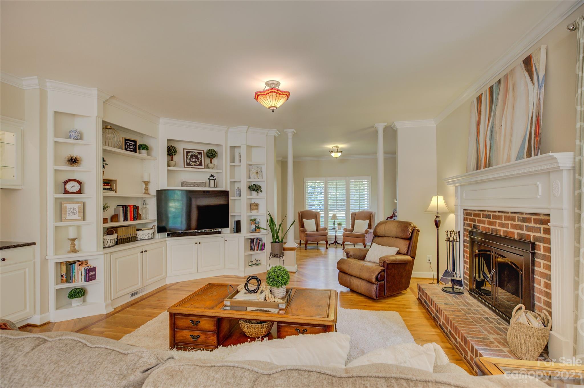 12017 Forest Home Drive Fort Mill, SC 29708 - Photo 12 of 44 a living room with furniture a fireplace and a flat screen tv