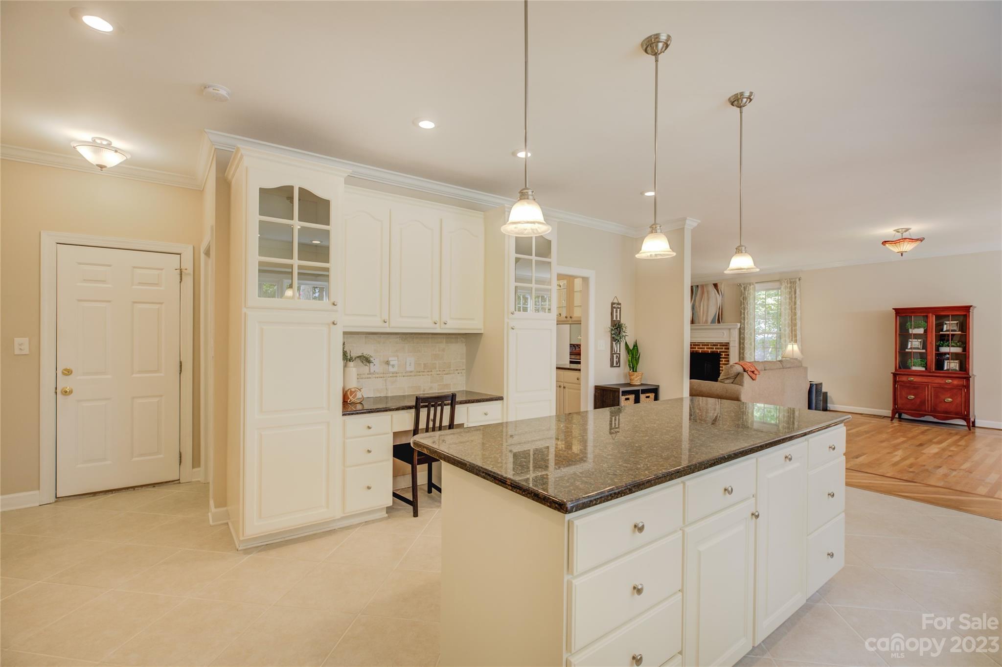 12017 Forest Home Drive Fort Mill, SC 29708 - Photo 16 of 44 a kitchen with center island and a view of living room