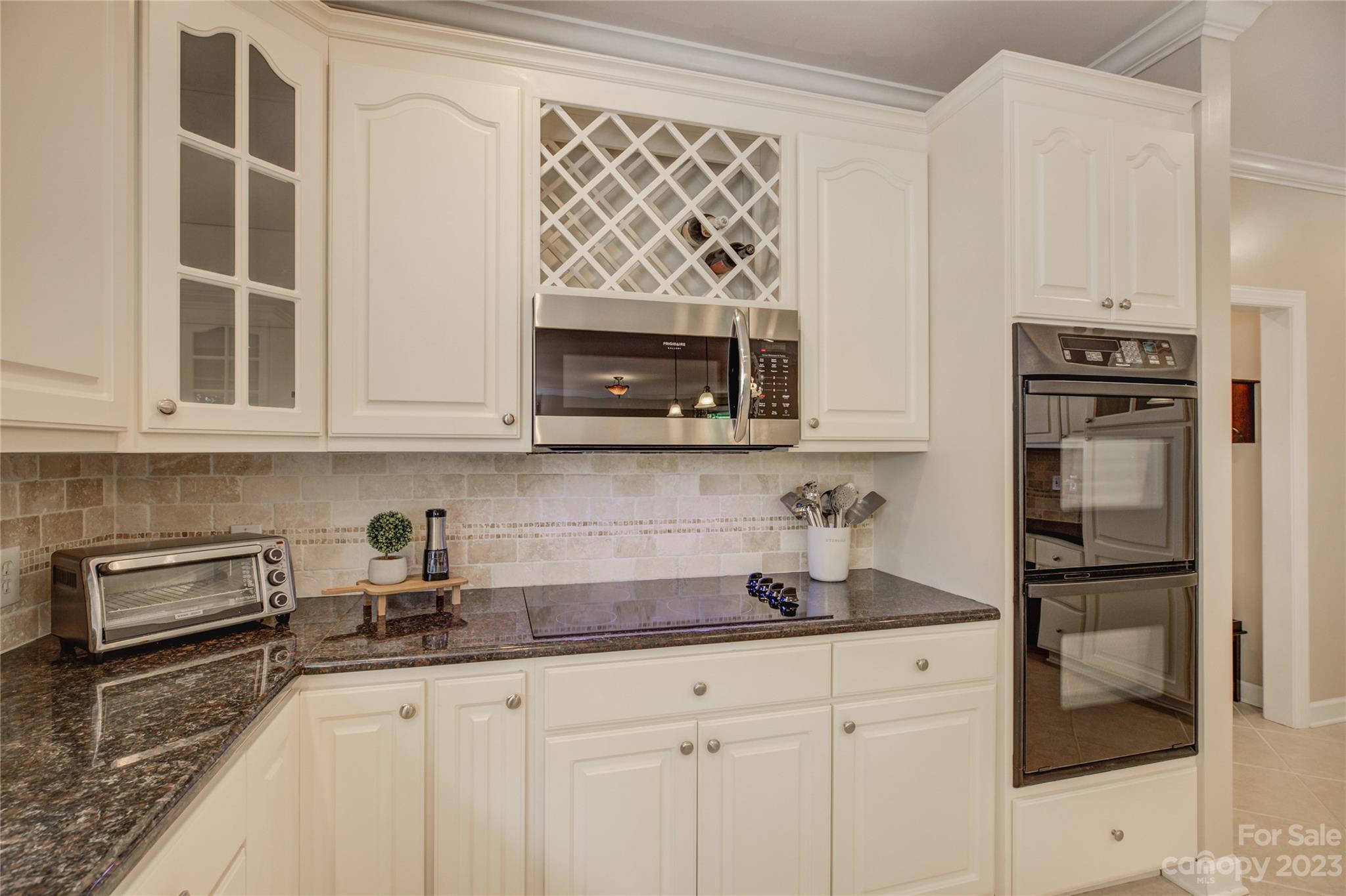 12017 Forest Home Drive Fort Mill, SC 29708 - Photo 17 of 44 a kitchen with stainless steel appliances granite countertop a sink and a microwave