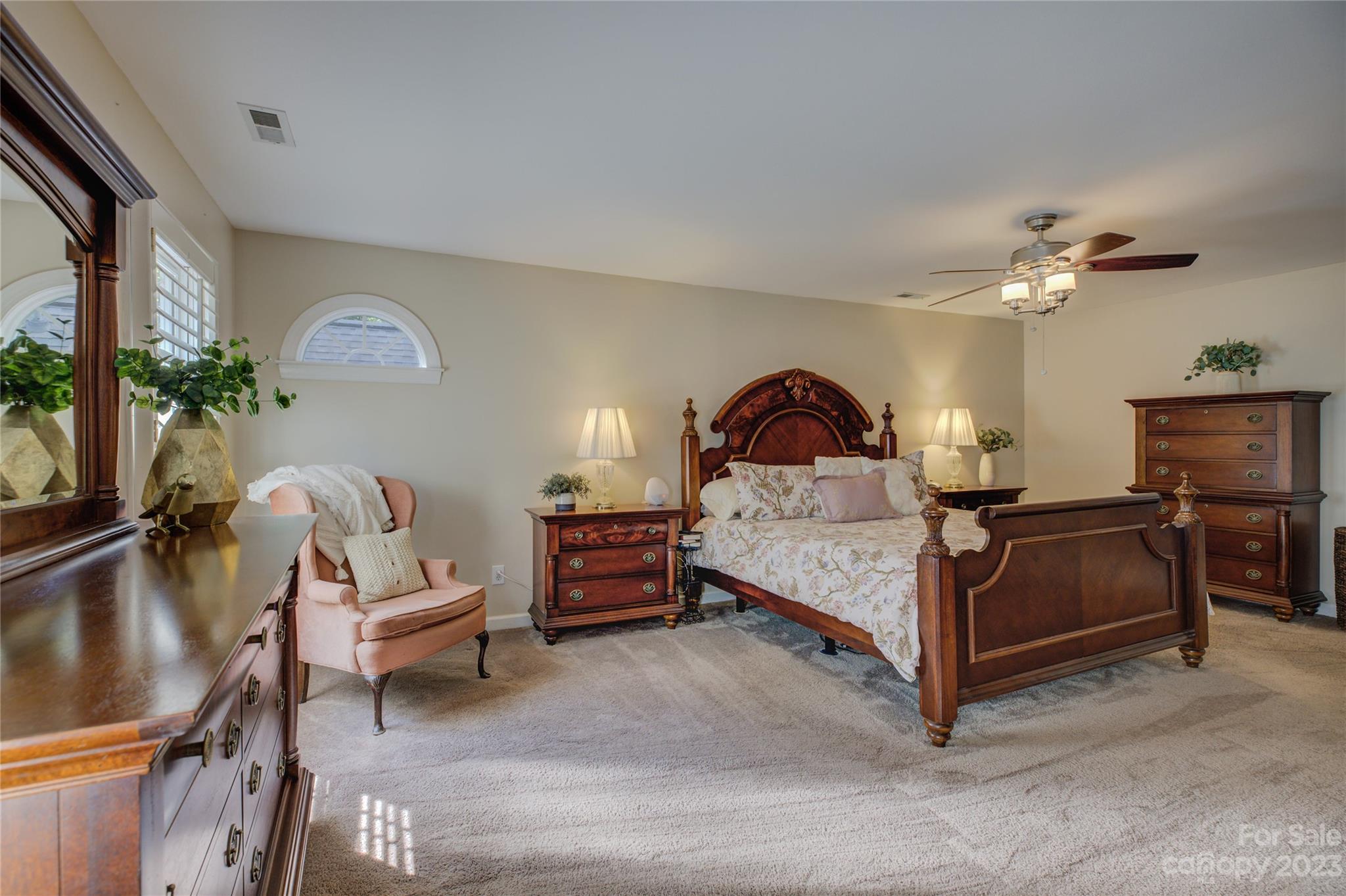 12017 Forest Home Drive Fort Mill, SC 29708 - Photo 25 of 44 a bedroom with a bed and a chandelier