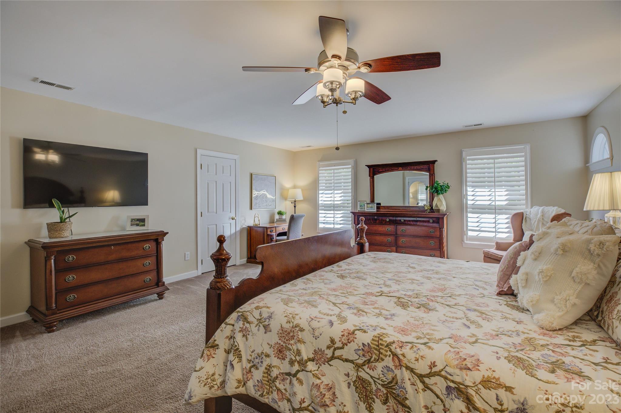 12017 Forest Home Drive Fort Mill, SC 29708 - Photo 26 of 44 a bedroom with a large bed and flat tv