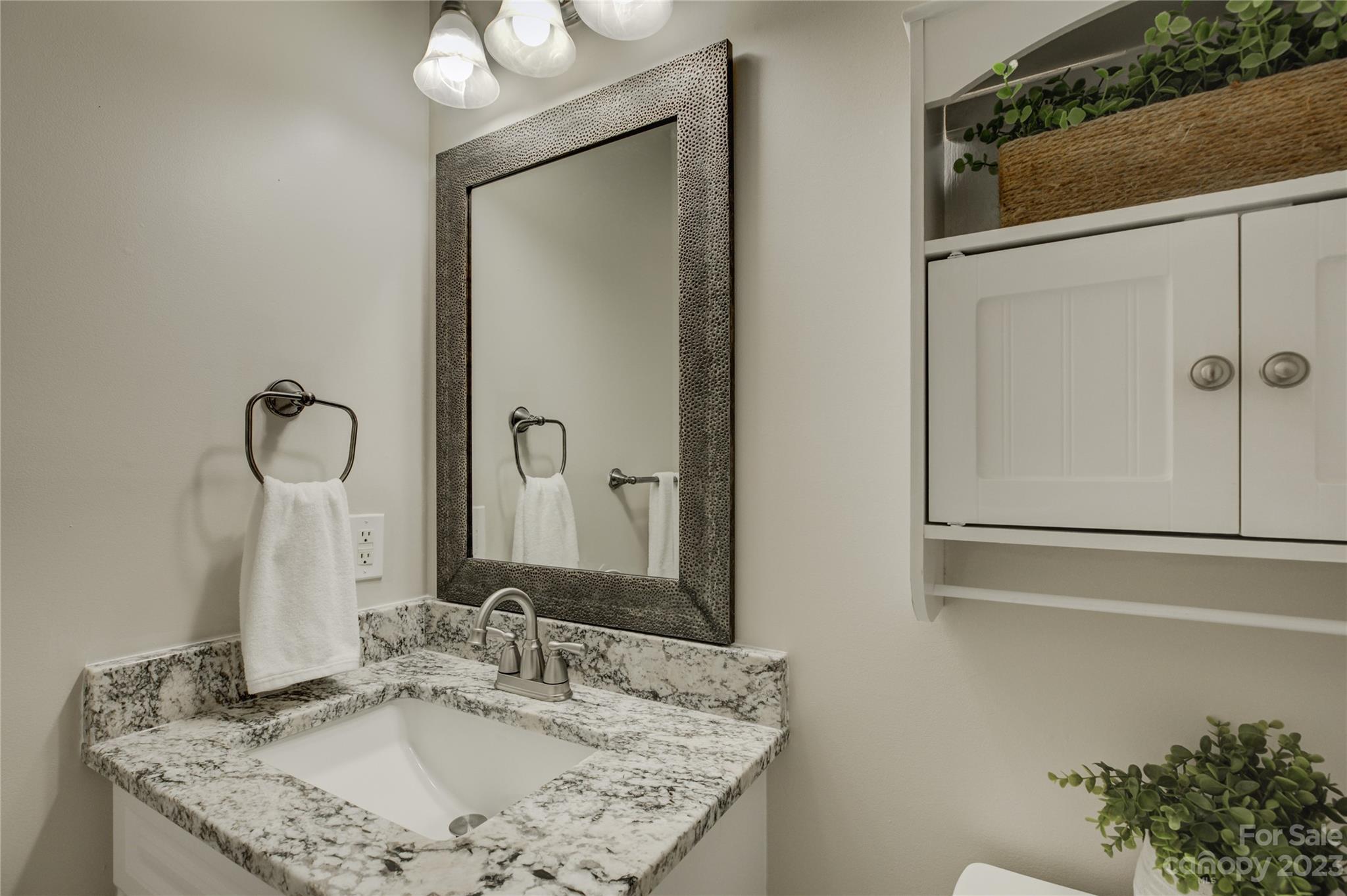 12017 Forest Home Drive Fort Mill, SC 29708 - Photo 33 of 44 a bathroom with a granite countertop sink and a mirror