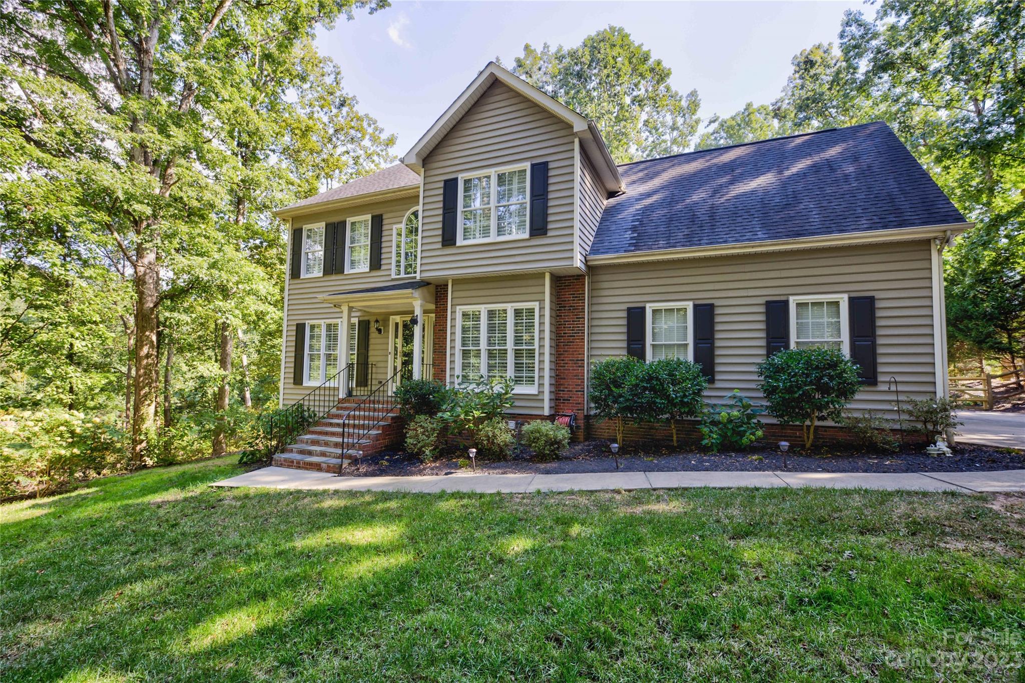 12017 Forest Home Drive Fort Mill, SC 29708 - Photo 4 of 44 a front view of a house with a yard