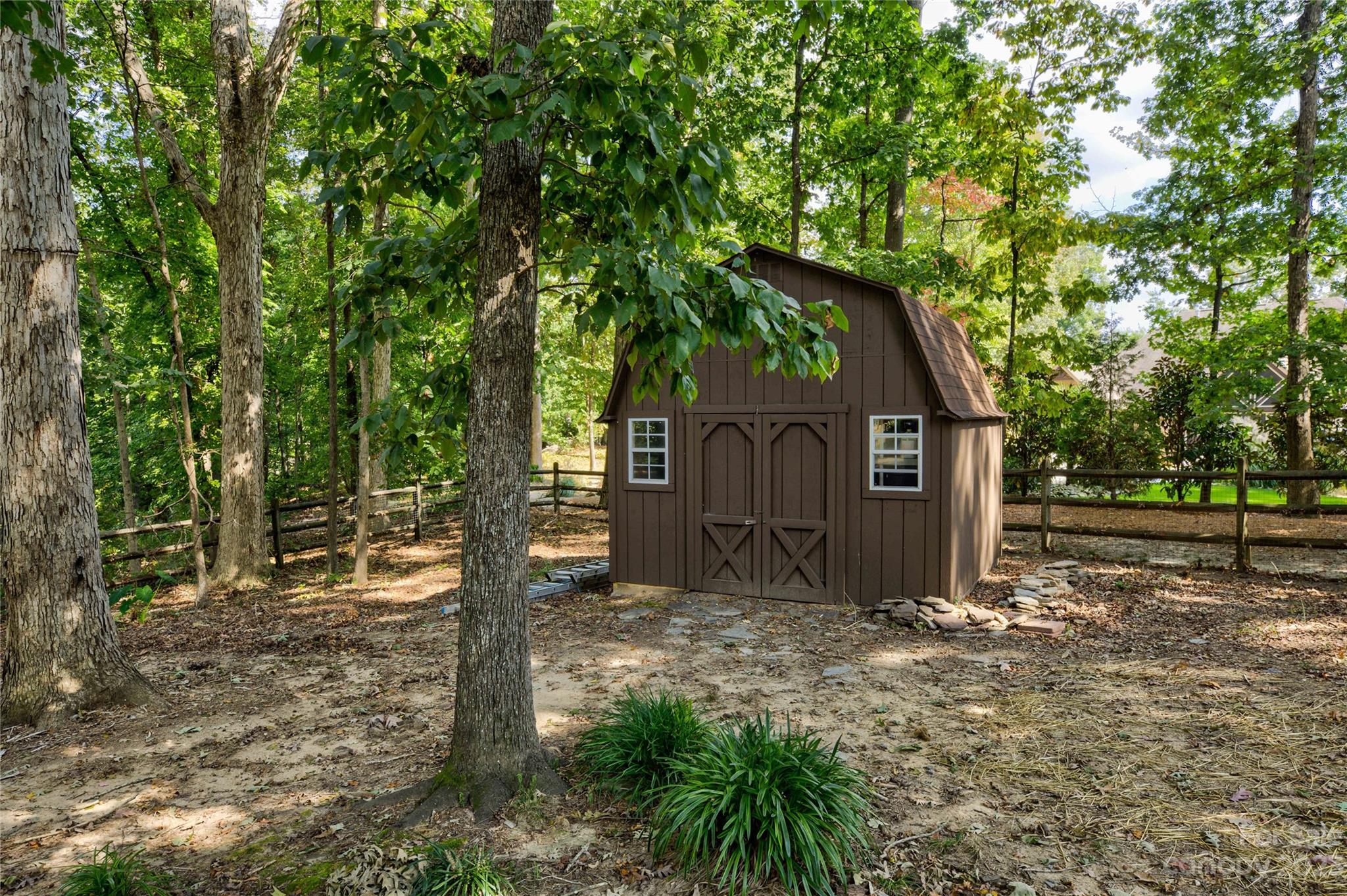 12017 Forest Home Drive Fort Mill, SC 29708 - Photo 42 of 44 a wooden house with large trees