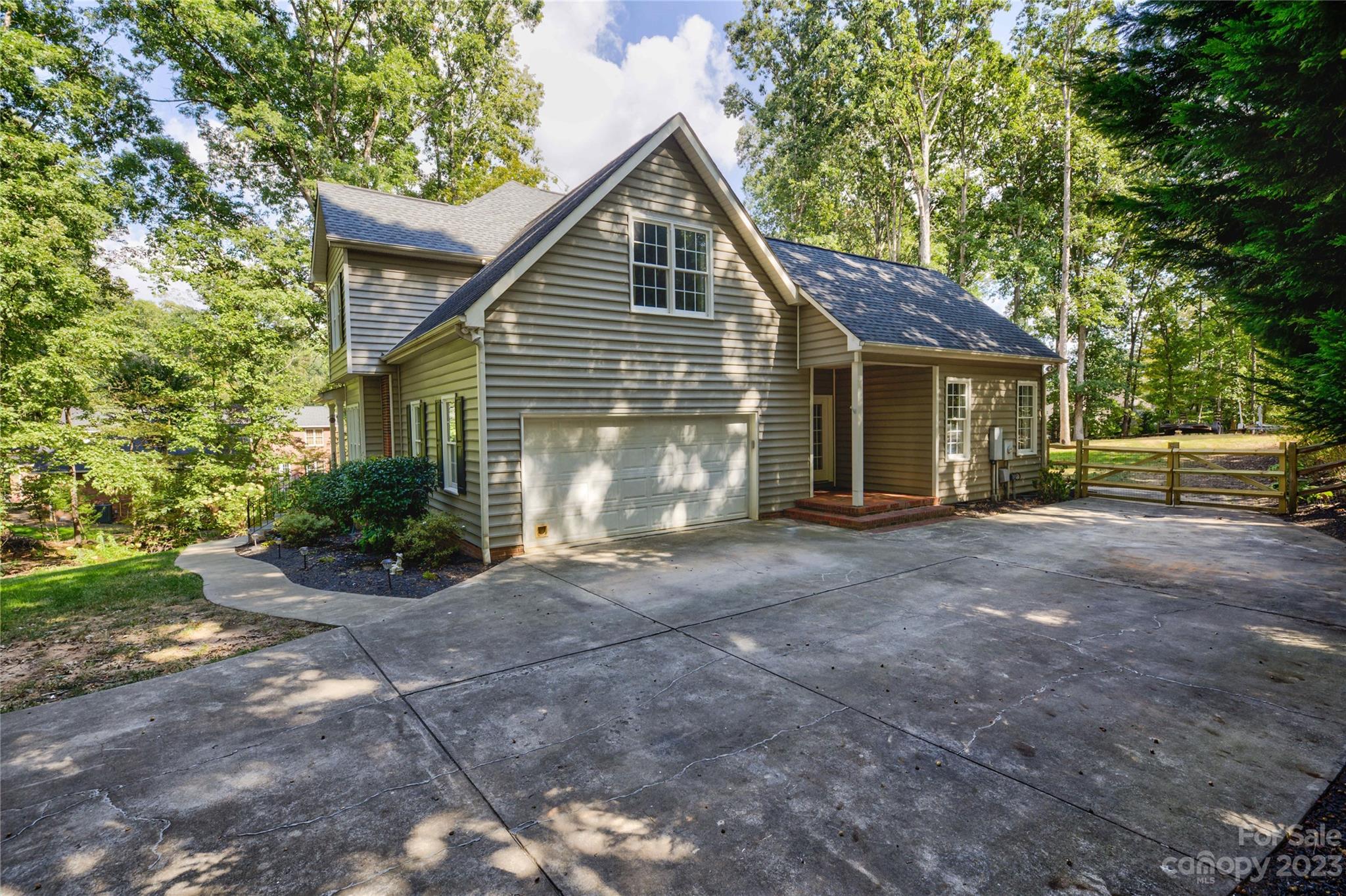 12017 Forest Home Drive Fort Mill, SC 29708 - Photo 43 of 44 a view of a house with a yard and large tree