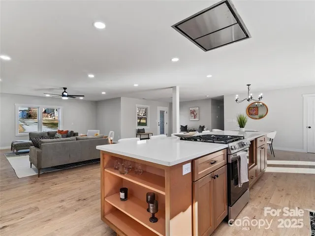 a kitchen with a stove and a table