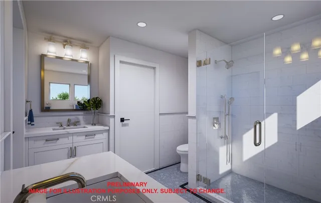 a spacious bathroom with a sink a toilet a shower and a mirror