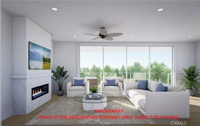 a living room with furniture fireplace and a large window