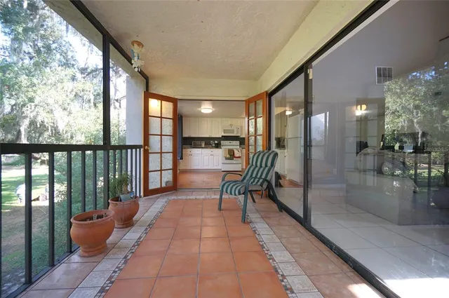 a lobby with furniture and outdoor view