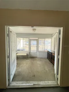 a view of an empty room with a fireplace