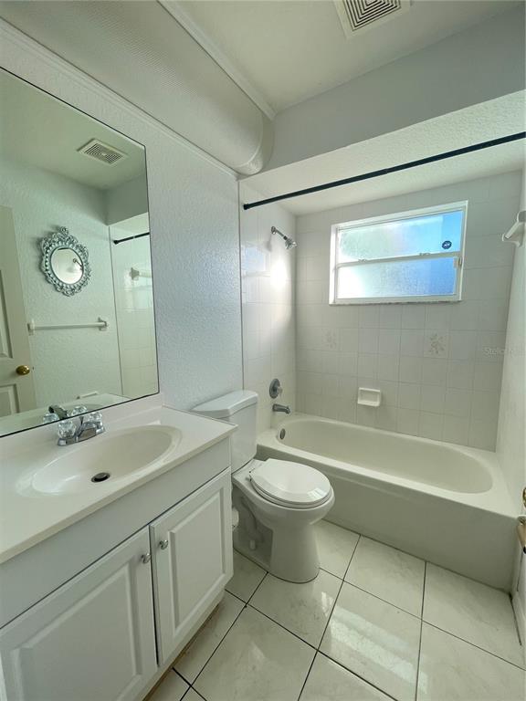 11322 Topaz Street Spring Hill, FL 34608 - Photo 22 of 41 a bathroom with a sink a toilet and a bathtub