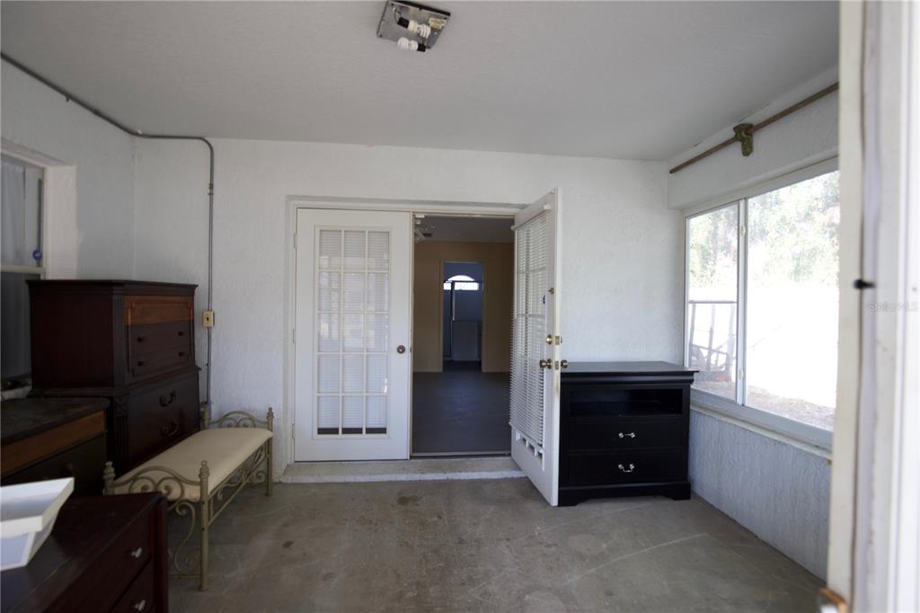 11322 Topaz Street Spring Hill, FL 34608 - Photo 23 of 41 a living room with furniture and a window