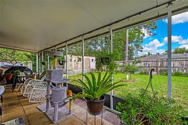 a view of a house with a yard porch and sitting area