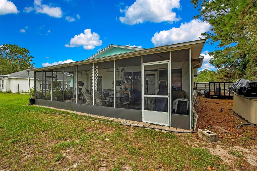 11322 Topaz Street Spring Hill, FL 34608 - Photo 28 of 41 a view of a porch with a backyard