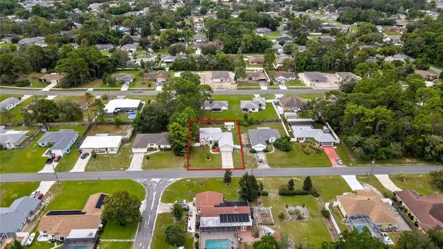 an aerial view of a house with a garden