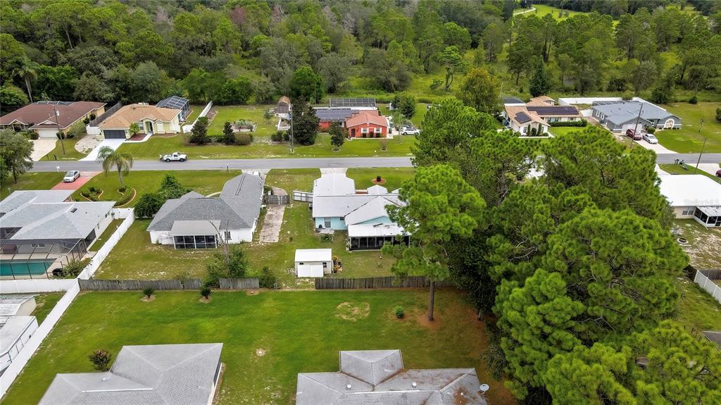 11322 Topaz Street Spring Hill, FL 34608 - Photo 37 of 41 an aerial view of a house with a garden and swimming pool