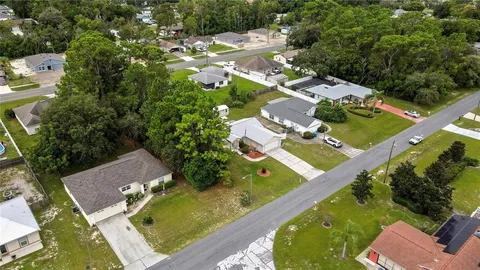 an aerial view of a house with a garden