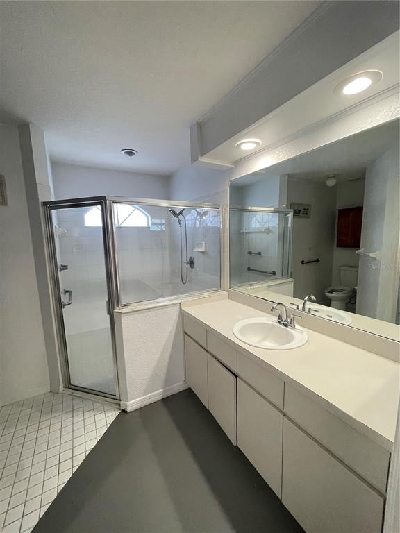 11322 Topaz Street Spring Hill, FL 34608 - Photo 9 of 41 a bathroom with a sink a toilet and mirror