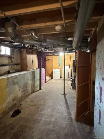 a view of empty room with wooden walls