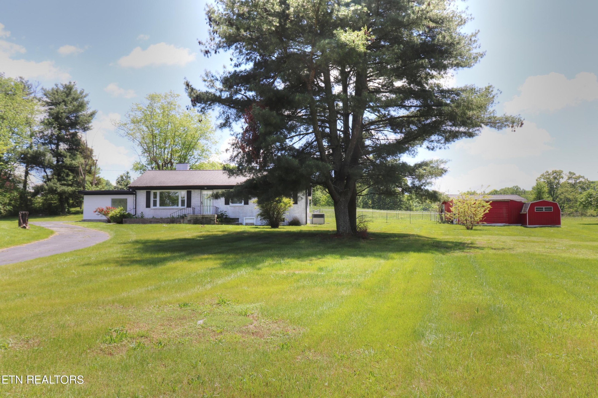 4004 Old Kentucky Road Morristown, TN 37814 - Photo 1 of 42 a front view of a house with swimming pool and porch