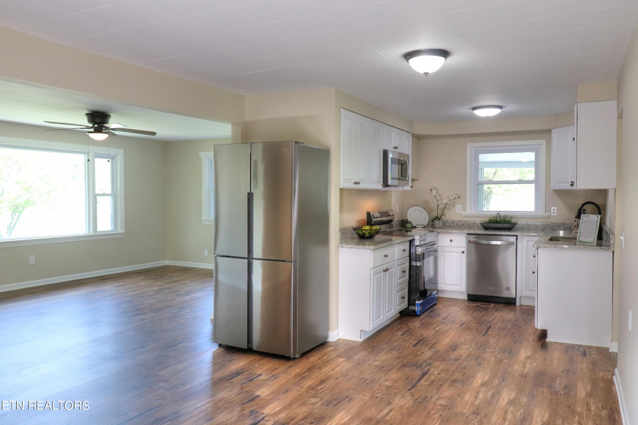 4004 Old Kentucky Road Morristown, TN 37814 - Photo 18 of 42 a kitchen with a refrigerator wooden floor and a window
