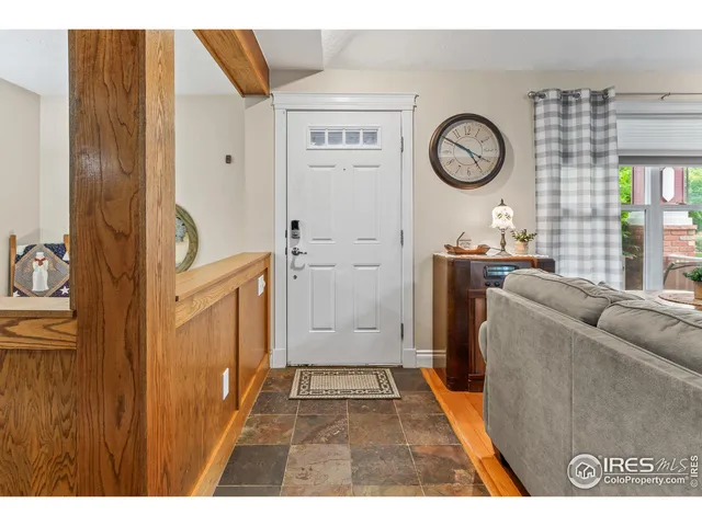 a kitchen with kitchen island granite countertop a refrigerator stove top oven and sink