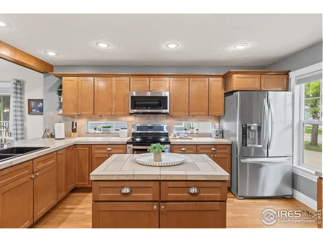 a view of a livingroom with furniture and staircase