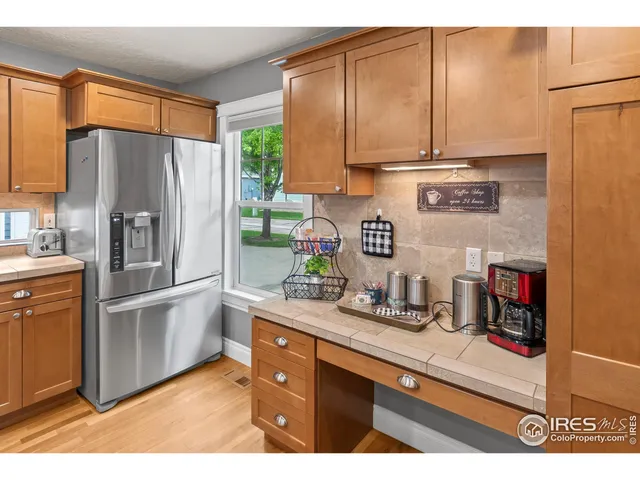 a spacious bathroom with a tub sink and mirror