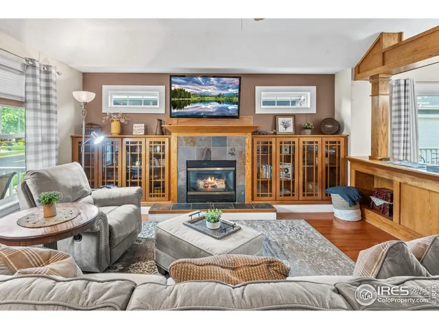 a living room filled with furniture and a window