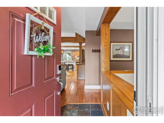 a view of a dining room with furniture and a chandelier