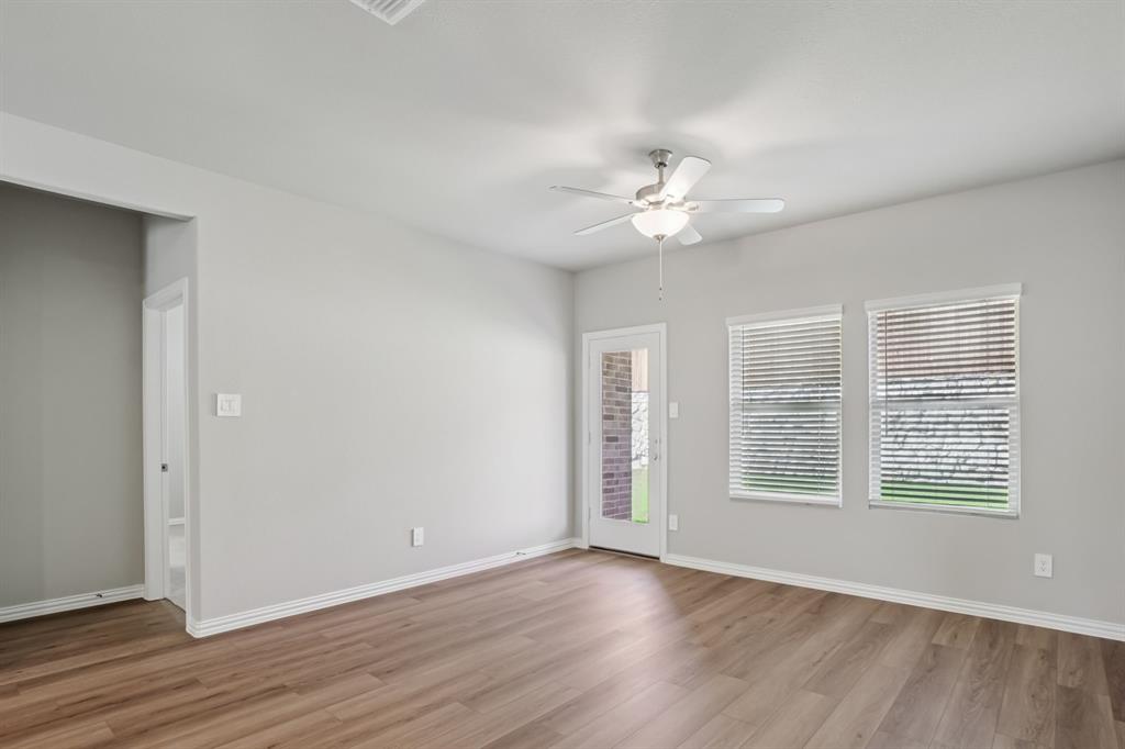 1725 Arches Road Anna, TX 75409 - Photo 12 of 28 wooden floor in an empty room with a window
