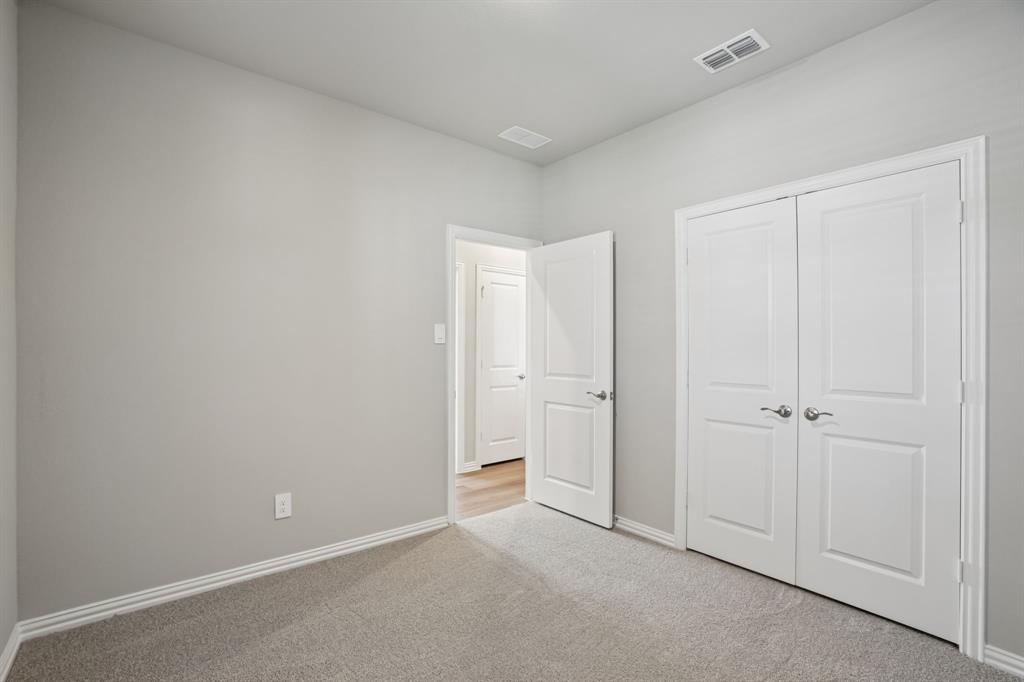 1725 Arches Road Anna, TX 75409 - Photo 21 of 28 a view of an empty room and closet area