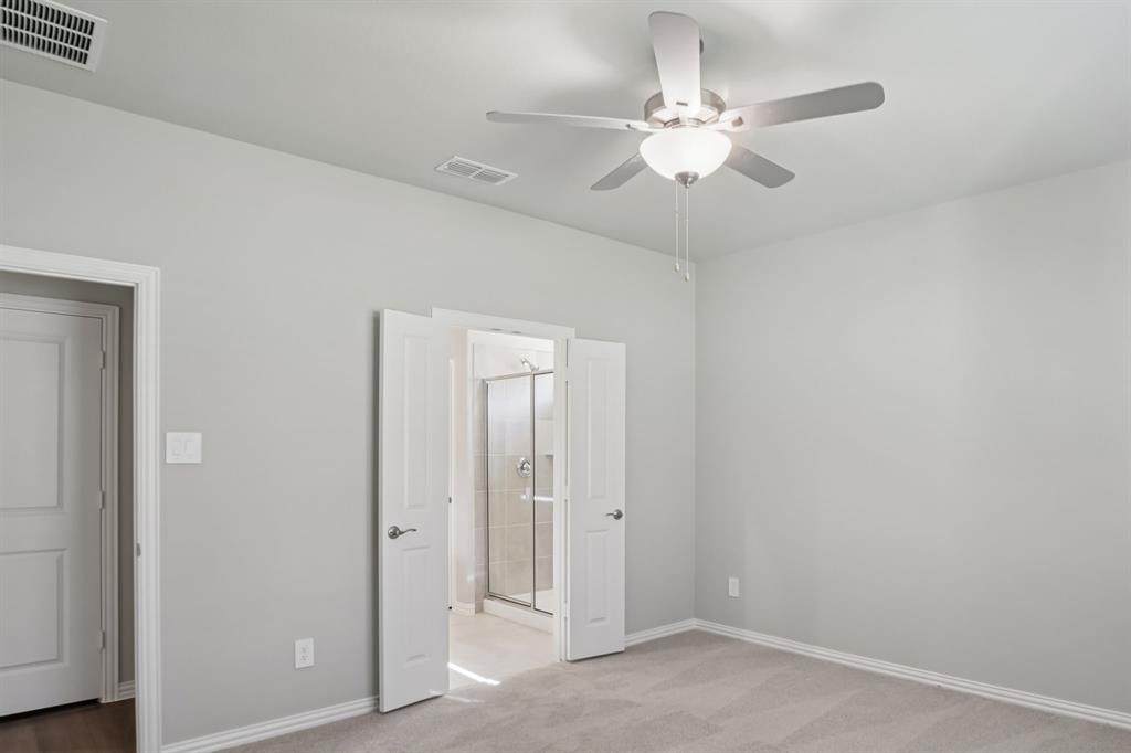 1725 Arches Road Anna, TX 75409 - Photo 23 of 28 an empty room with fan and entryway