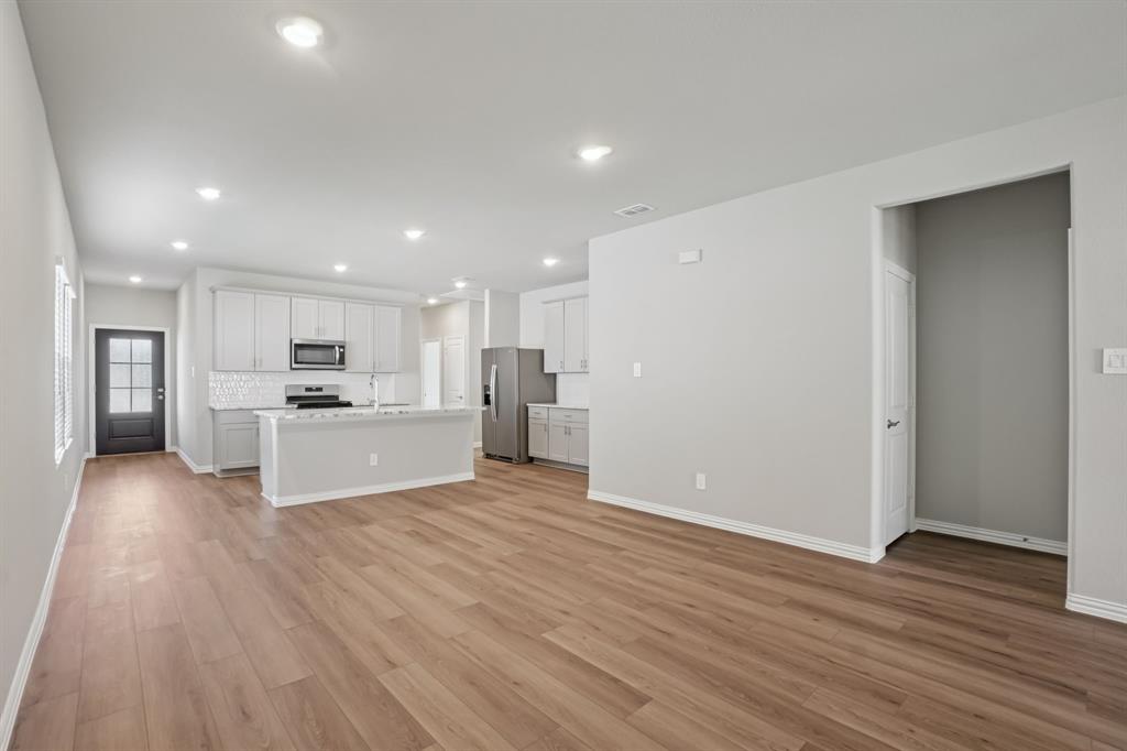 1725 Arches Road Anna, TX 75409 - Photo 9 of 28 a view of kitchen view wooden floor and kitchen