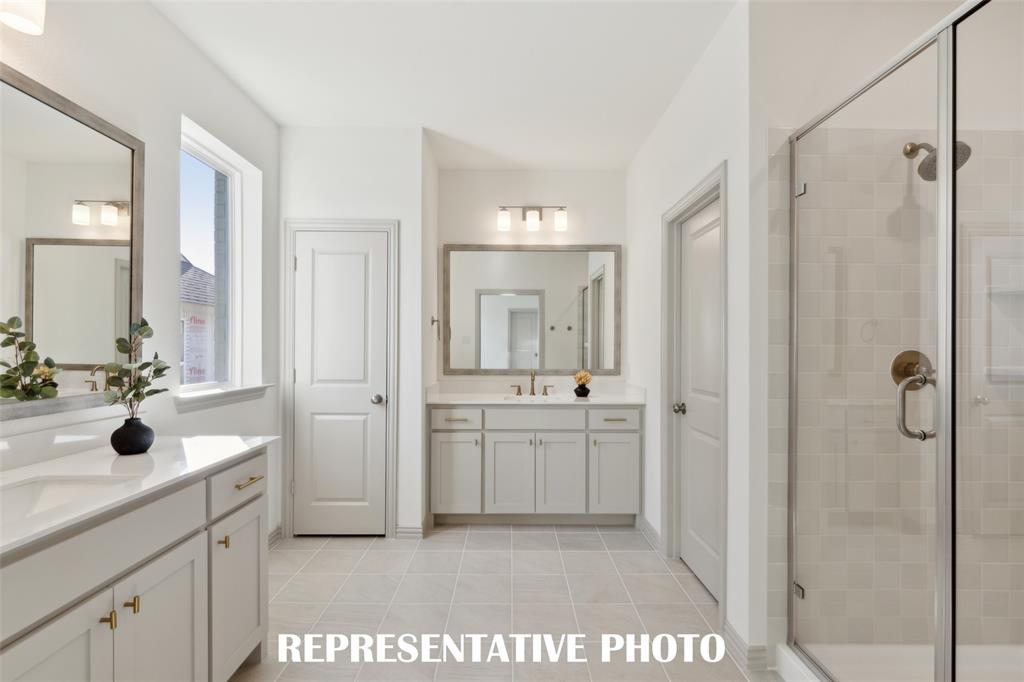 1401 Rooted Road Frisco, TX 75033 - Photo 9 of 15 Gorgeous and inviting plus plenty of room for two, you will love calling this owner's bath your own! REPRESENTATIVE PHOTO