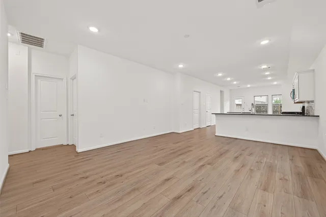 a view of kitchen cabinet and microwave