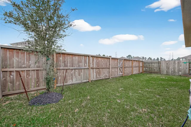 a view of backyard with green space