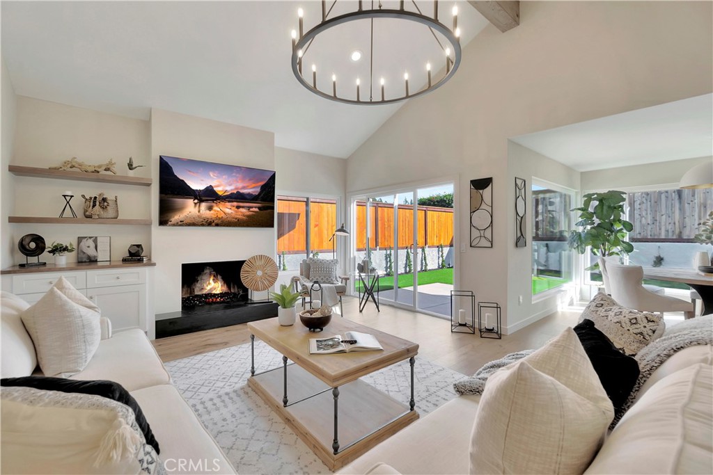 545 North Broadmoor Trail Orange, CA 92869 - Photo 16 of 75 a living room with furniture a fireplace and a flat screen tv